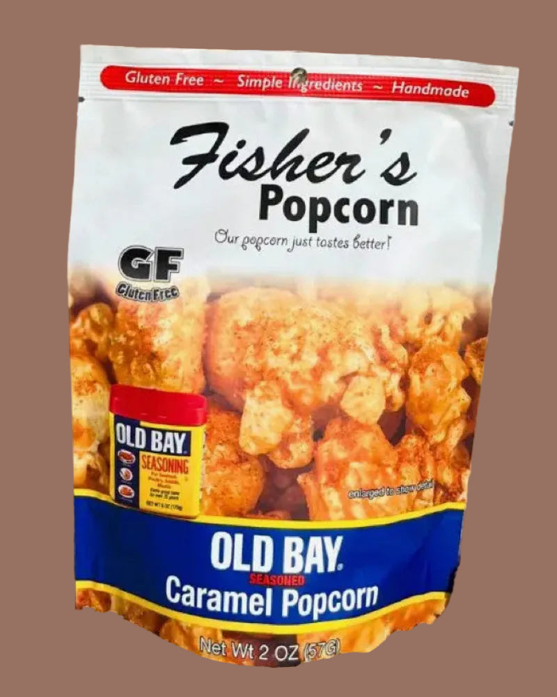 Fisher's Popcorn Old Bay Caramel Popcorn package on sand