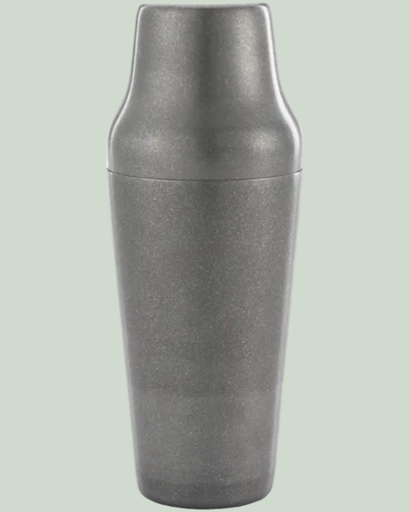 Metallic gray shaker on a light green background