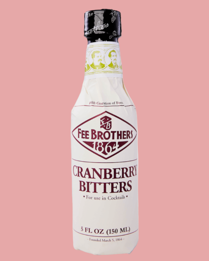 Bottle of Fee Brothers Cranberry Bitters on a pink background