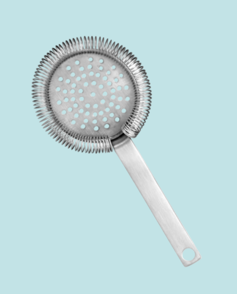 Metallic cocktail strainer on a light blue background