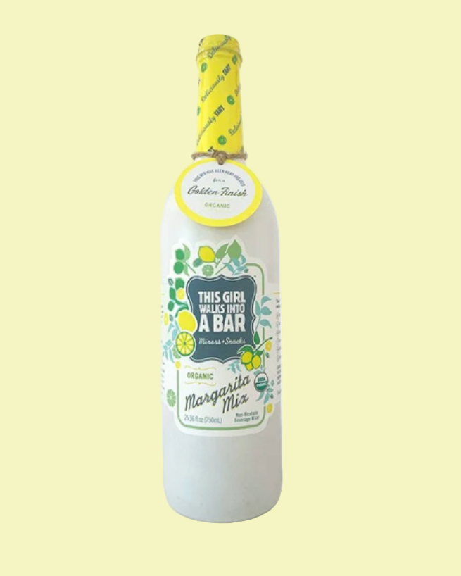 Bottle of margarita mix with decorative label on a light yellow background
