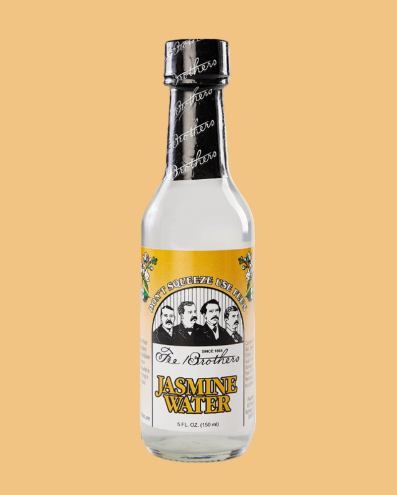 Bottle of 'The Brothers' Jasmine Water on a beige background