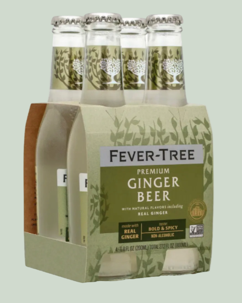 Pack of Fever-Tree Premium Ginger Beer bottles on a light green background