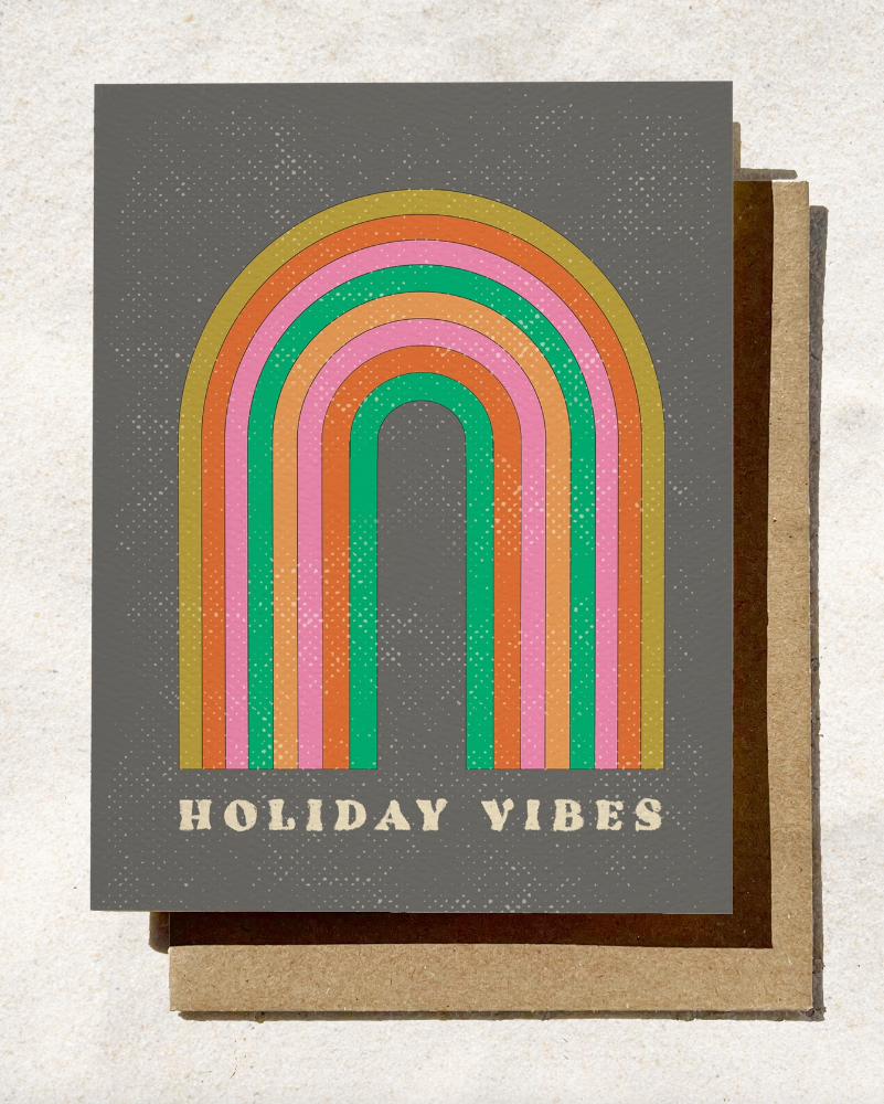 Greeting card with rainbow design and 'Holiday Vibes' text on a gray background