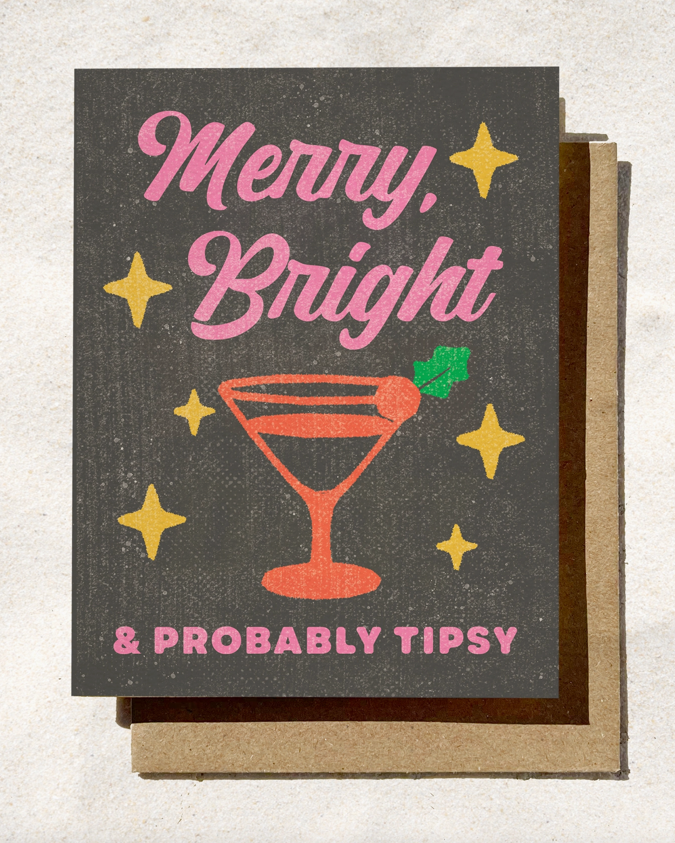 Greeting card with 'Merry, Bright & Probably Tipsy' text and a martini glass illustration on a textured background.