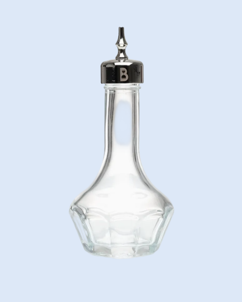 Clear glass bottle with silver cap on a light blue background