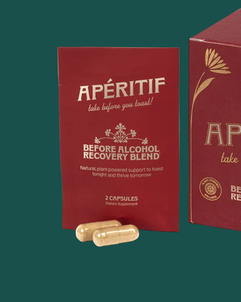 Red packaging of 'Apéritif' before alcohol recovery blend with capsules on a green background