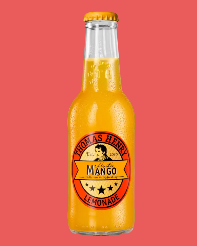 Glass bottle of Thomas Henry Mango Lemonade on a white background