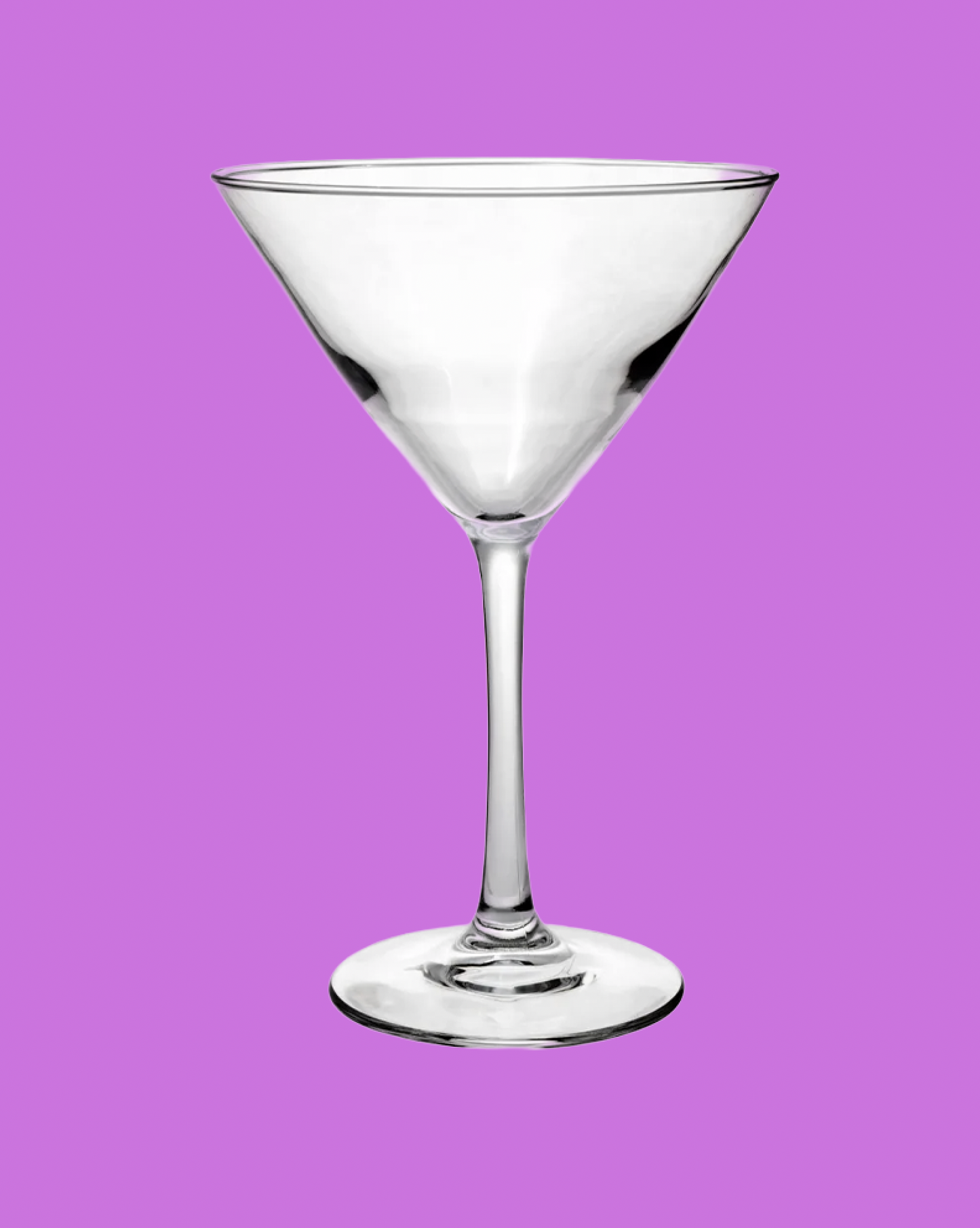 Clear martini glass on a purple background