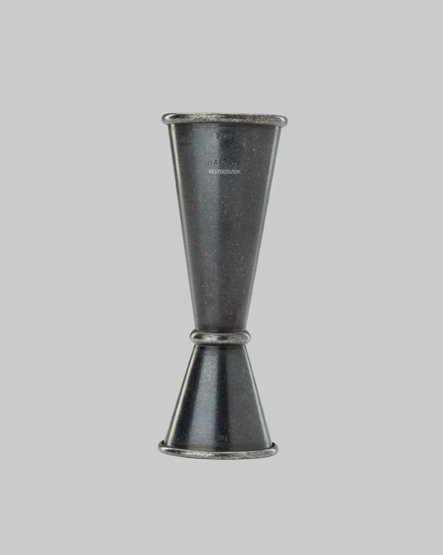 Metallic jigger on a gray background