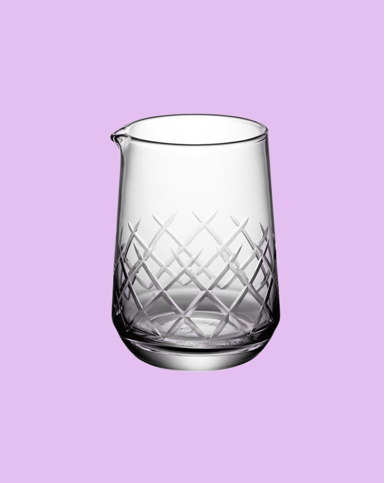Clear glass pitcher with diamond pattern on a light purple background