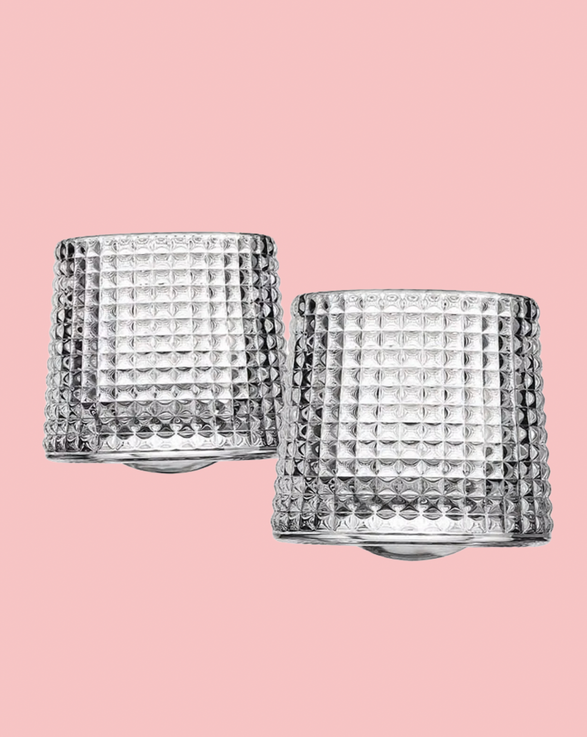 TEXTURED TUMBLERS ON A PINK BACKGROUND