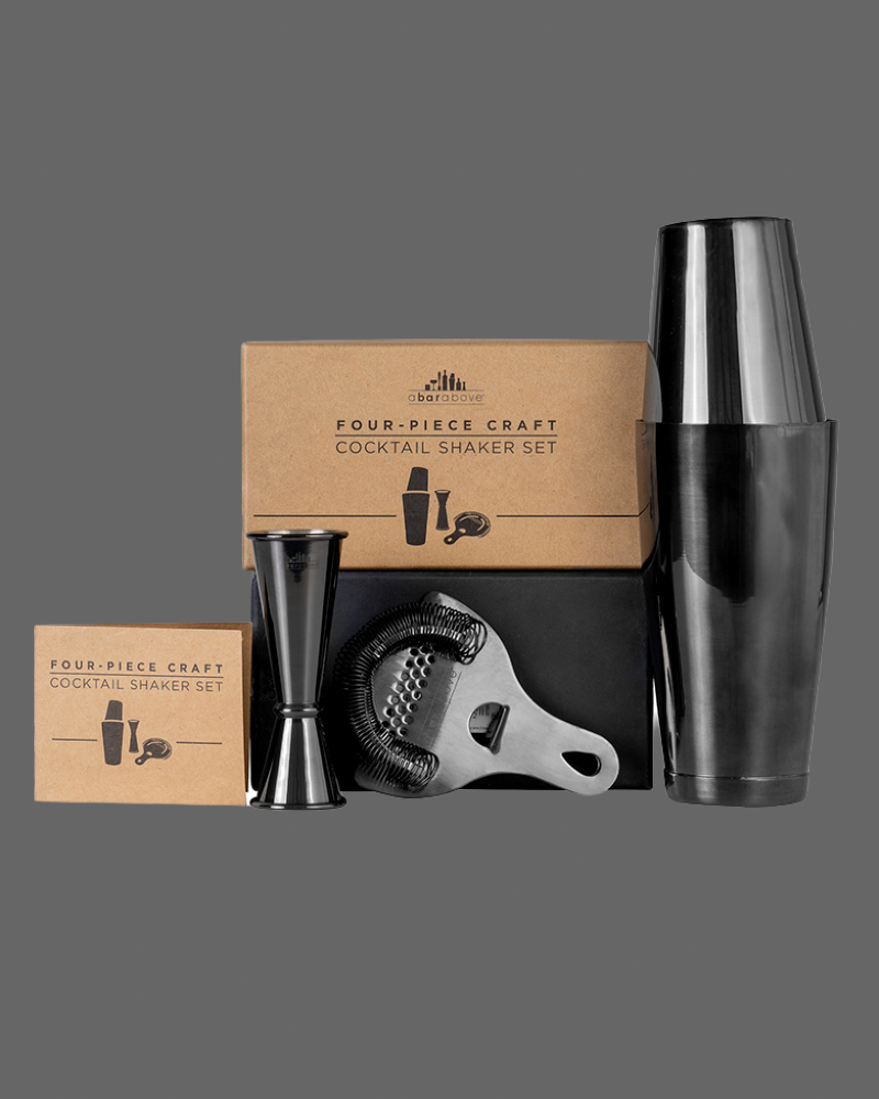 Four-piece craft cocktail shaker set with packaging on a gray background
