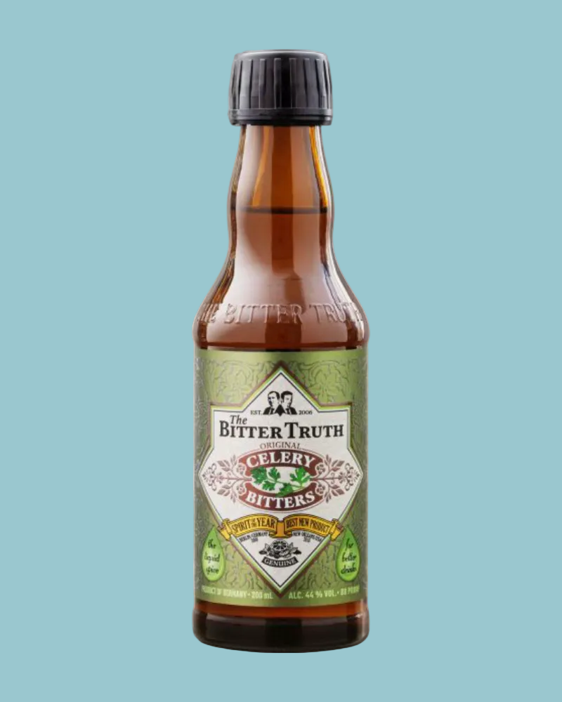 A bottle of The Bitter Truth Celery Bitters on a light gray textured background. The product features an amber glass bottle with a black cap and a green and white label.