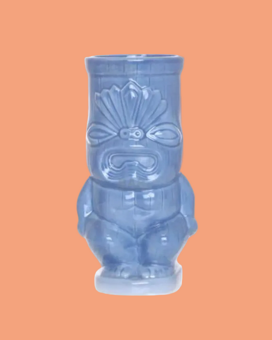 Blue tiki mug with a traditional design on a white background