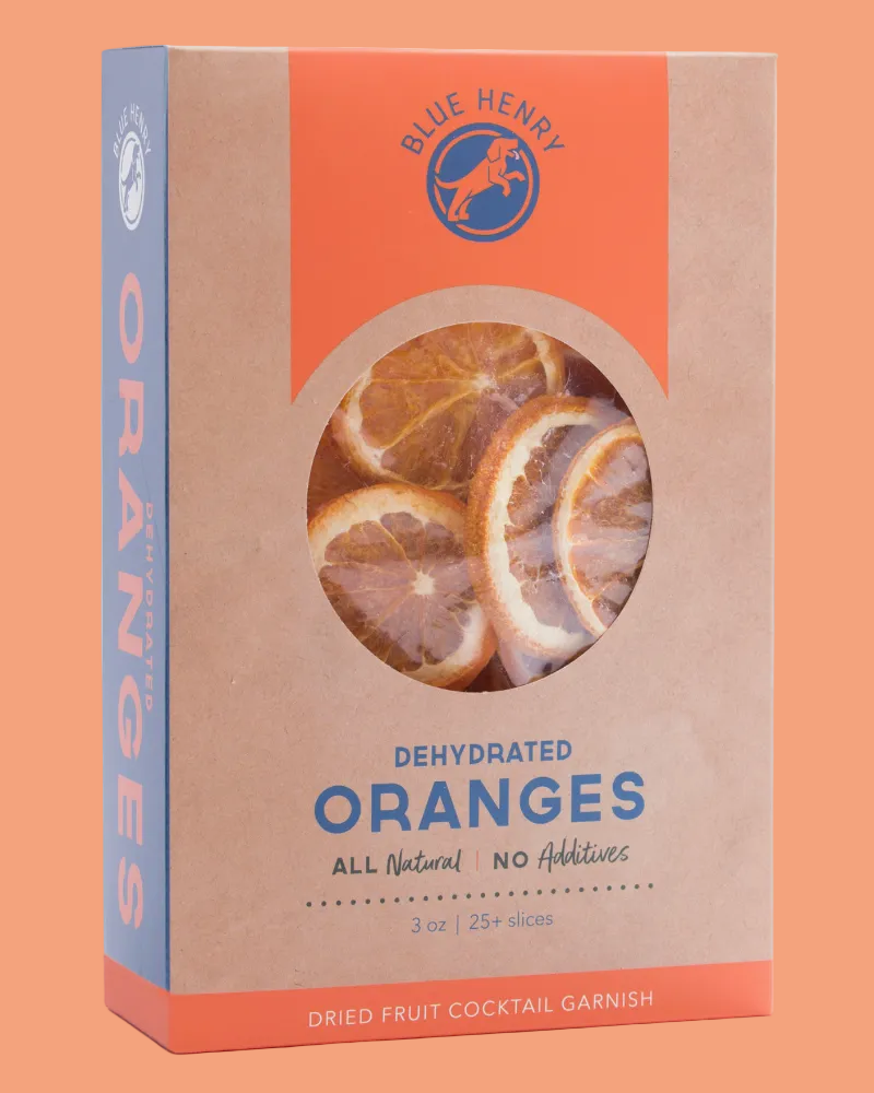 Blue Henry brand packaging box for dehydrated oranges, featuring a kraft brown box with a circular window showing dried orange slices, an orange top panel, and blue text.