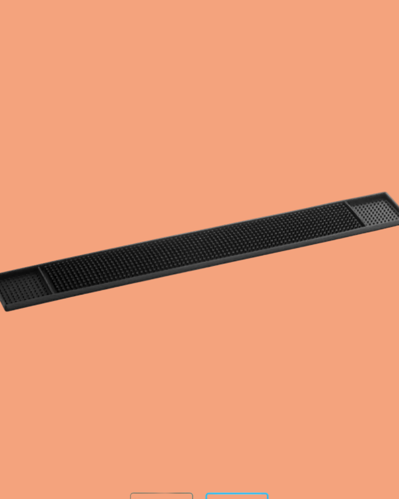 Black cylindrical object on a peach background
