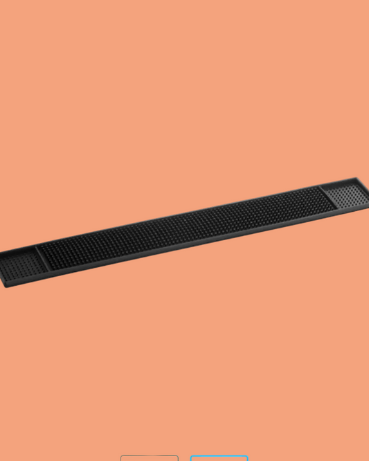 Black cylindrical object on a peach background