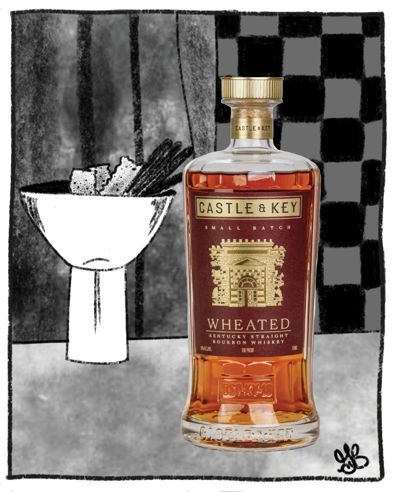 Bottle of Castle & Key wheated bourbon with a cocktail glass in the background