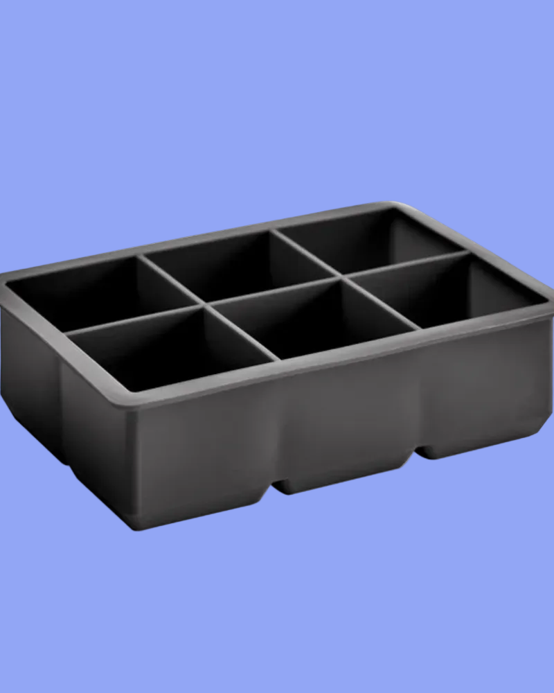 A black plastic 6-compartment ice cube tray shown at an angle against a solid light blue background.