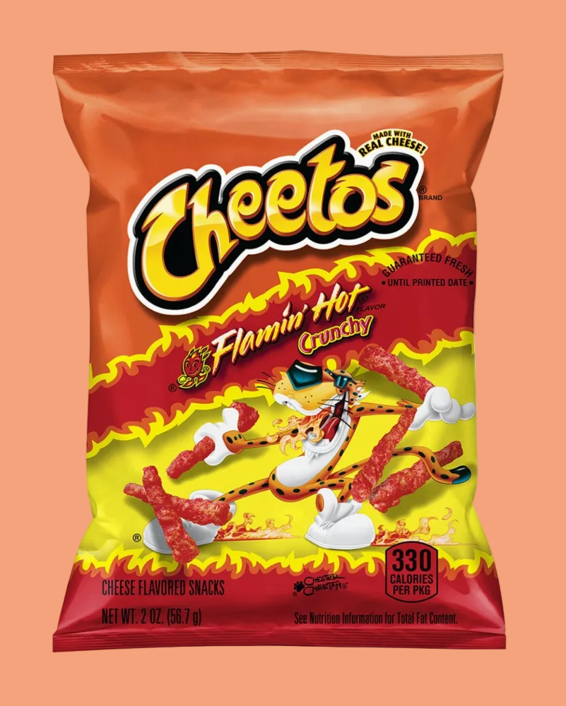 A bag of Cheetos Flamin' Hot Crunchy cheese flavored snacks, featuring the yellow Cheetos logo and cartoon character on a red and yellow flame design, set against a solid peach background.