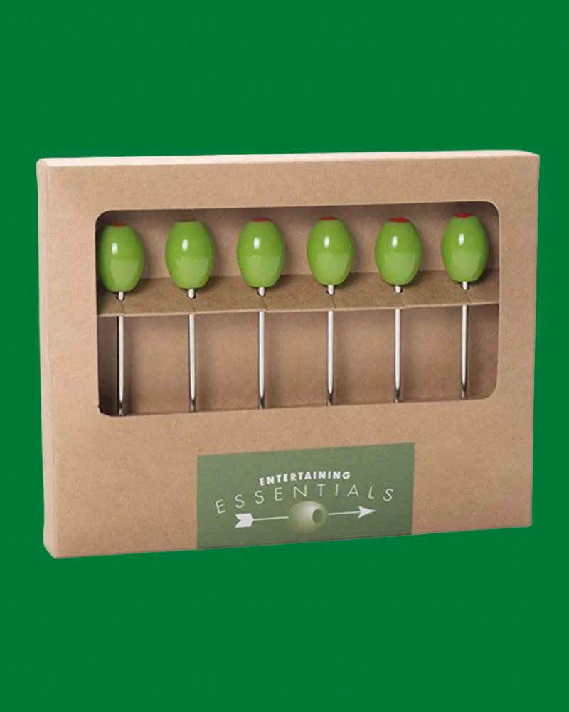 Set of green olives on toothpicks in a cardboard packaging with 'Entertaining Essentials' label.