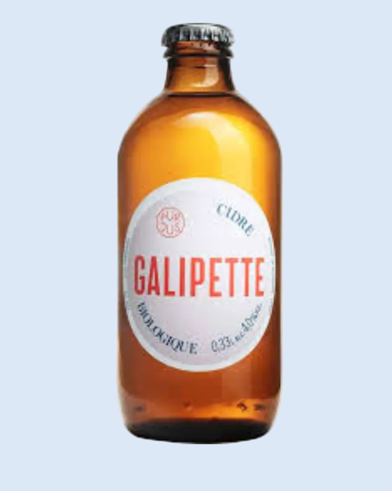 An amber glass bottle of Galipette sparkling cider with a white circular label and a black cap, shown on a plain white background.