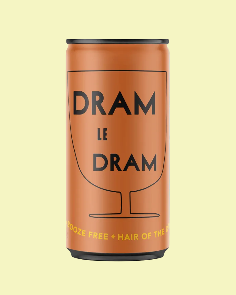 A slim copper-colored can with black text reading 'DRAM LE DRAM' and a black glass outline, plus small yellow text near the bottom, shown on a light gray background.