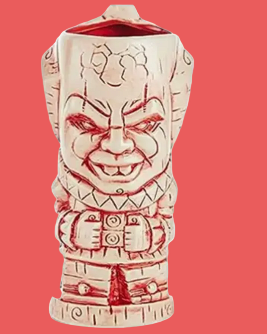 Tiki mug with a face design on a pink background