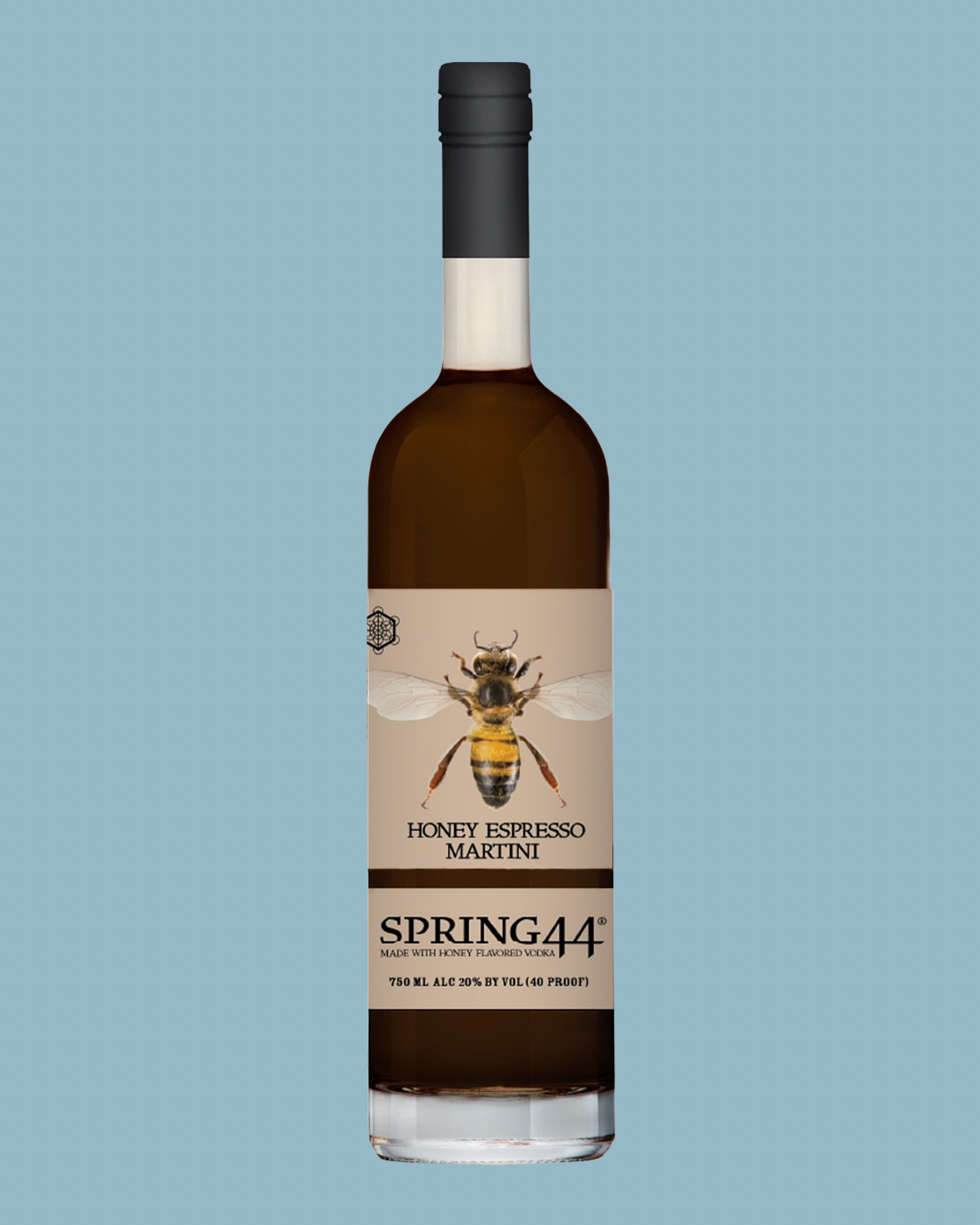 A bottle of Spring44 Honey Espresso Martini liqueur centered on a solid light blue background. The bottle is made of dark glass showing the dark brown liquid inside, with a beige label featuring a detailed illustration of a bee and the product name 'HONEY ESPRESSO MARTINI' and brand 'SPRING44'.