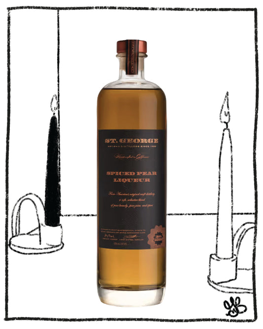 Bottle of St. George Spiced Rum Liqueur with candles in the background