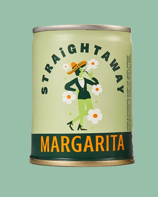 A cylindrical can of Straightaway Margarita beverage on a pale yellow background. The can has a light sage green label with a dark green band at the bottom, orange text reading 'MARGARITA', and an illustration of a woman in a sombrero surrounded by white flowers.
