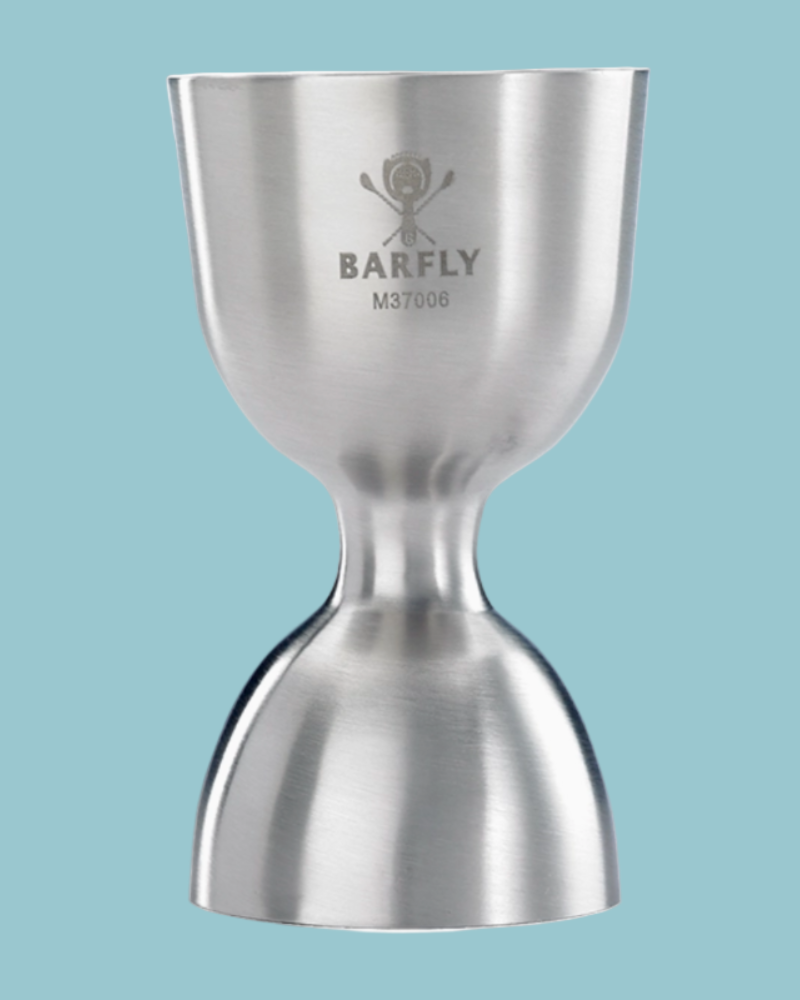Metallic jigger with Barfly branding on a light blue background