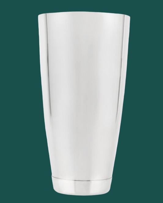 Silver metallic cup on a green background