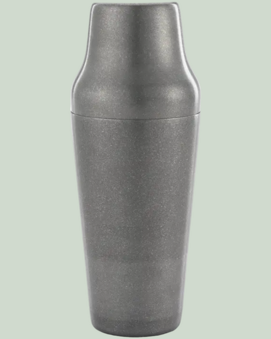 Metallic gray shaker on a light green background