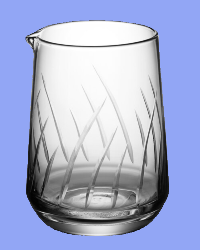Clear glass pitcher with engraved grass design on a blue background
