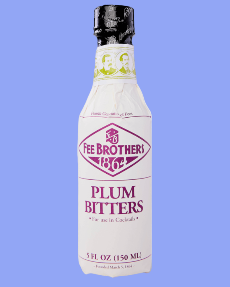 Bottle of Fee Brothers Plum Bitters on a light blue background