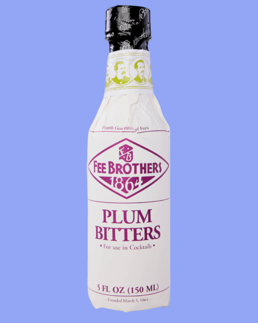 Bottle of Fee Brothers Plum Bitters on a light blue background