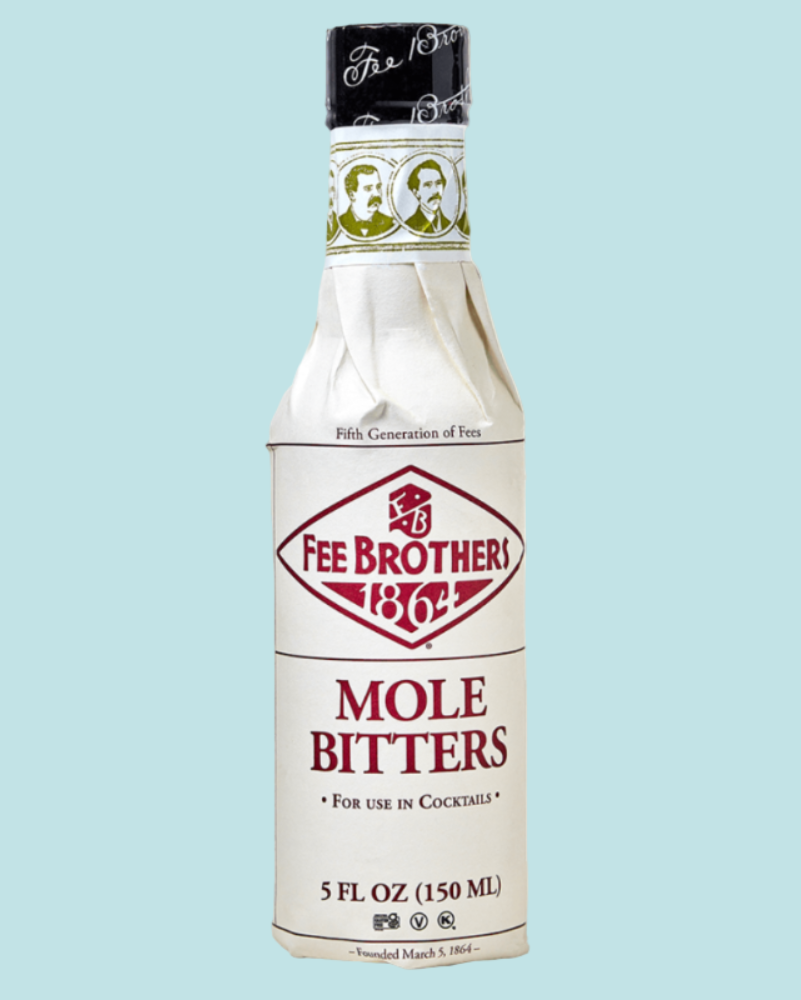 Bottle of Fee Brothers Mole Bitters on a light blue background