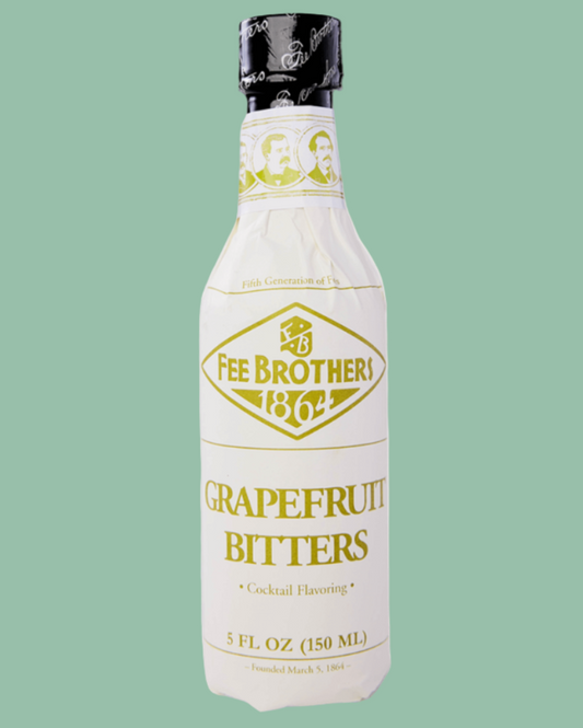 Bottle of Fee Brothers Grapefruit Bitters on a green background