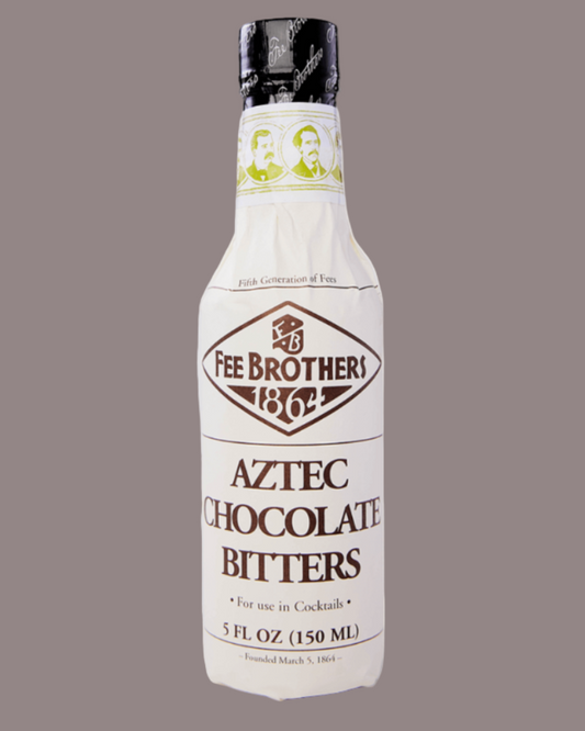 Bottle of Fee Brothers Aztec Chocolate Bitters on a gray background