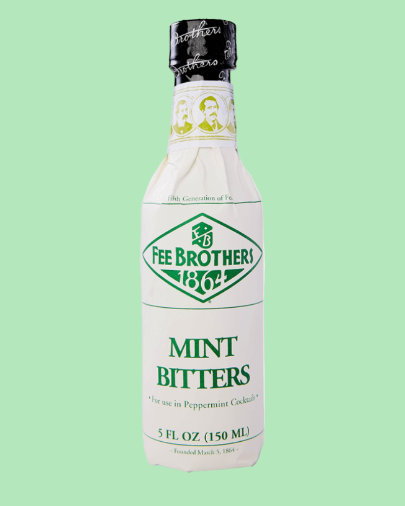 Bottle of Fee Brothers Mint Bitters on a light green background