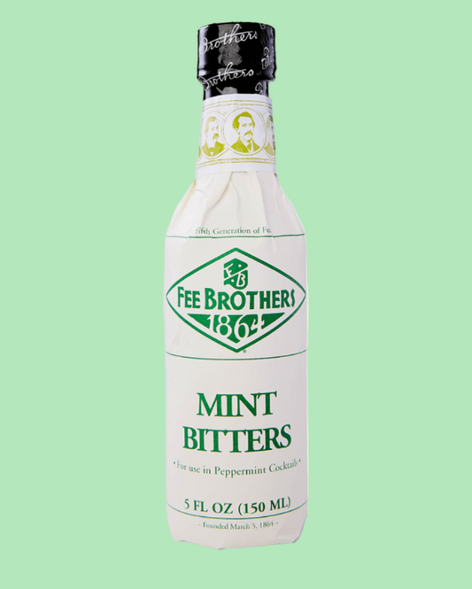 Bottle of Fee Brothers Mint Bitters on a light green background