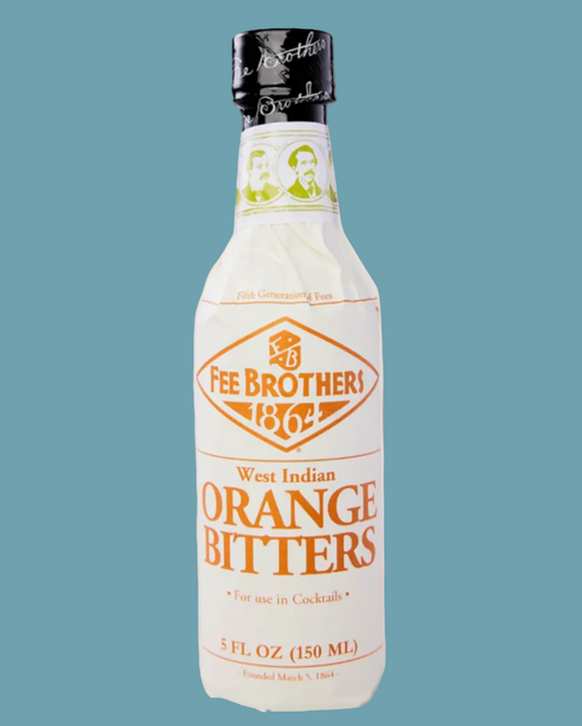Bottle of Fee Brothers West Indian Orange Bitters on a peach background