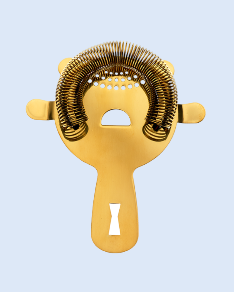 Gold metal cocktail strainer on a light blue background