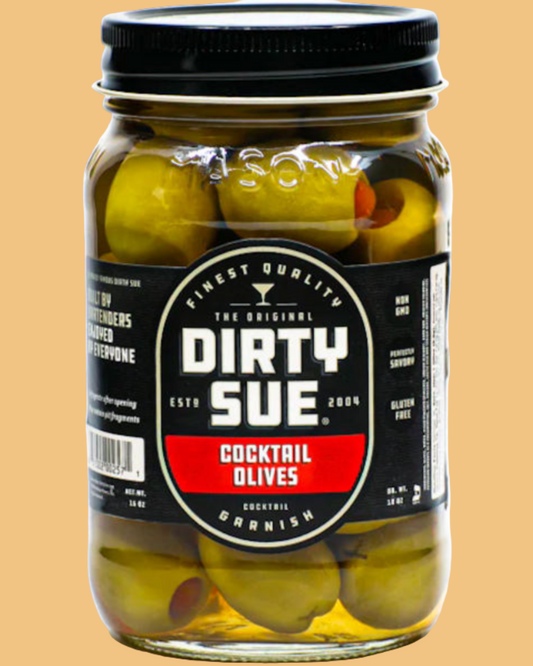 Jar of Dirty Sue cocktail olives on a beige background