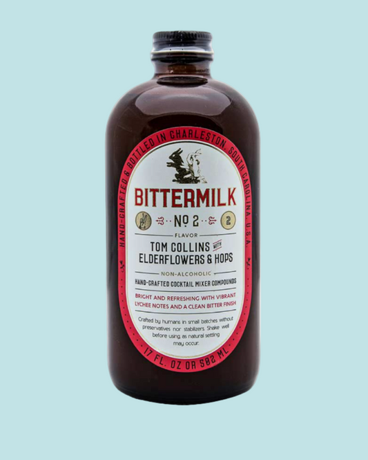 Bittermilk bottle with label on a light blue background