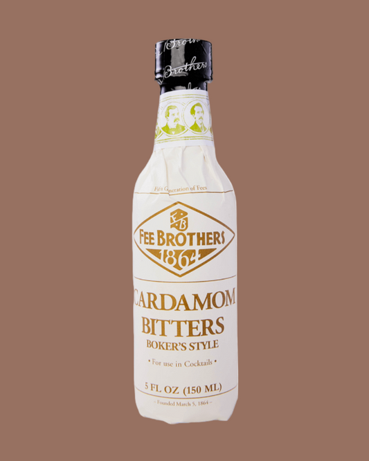 Bottle of Fee Brothers Cardamom Bitters on a brown background