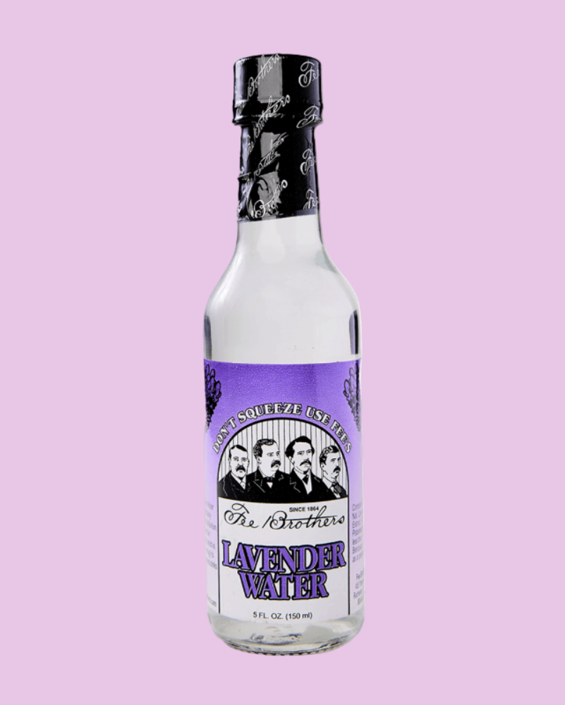 Bottle of lavender water with a purple label on a pink background