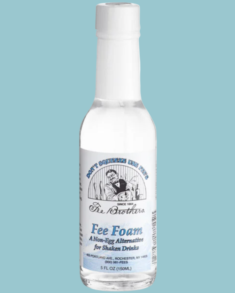 Bottle of Fee Foam with a label on a light blue background